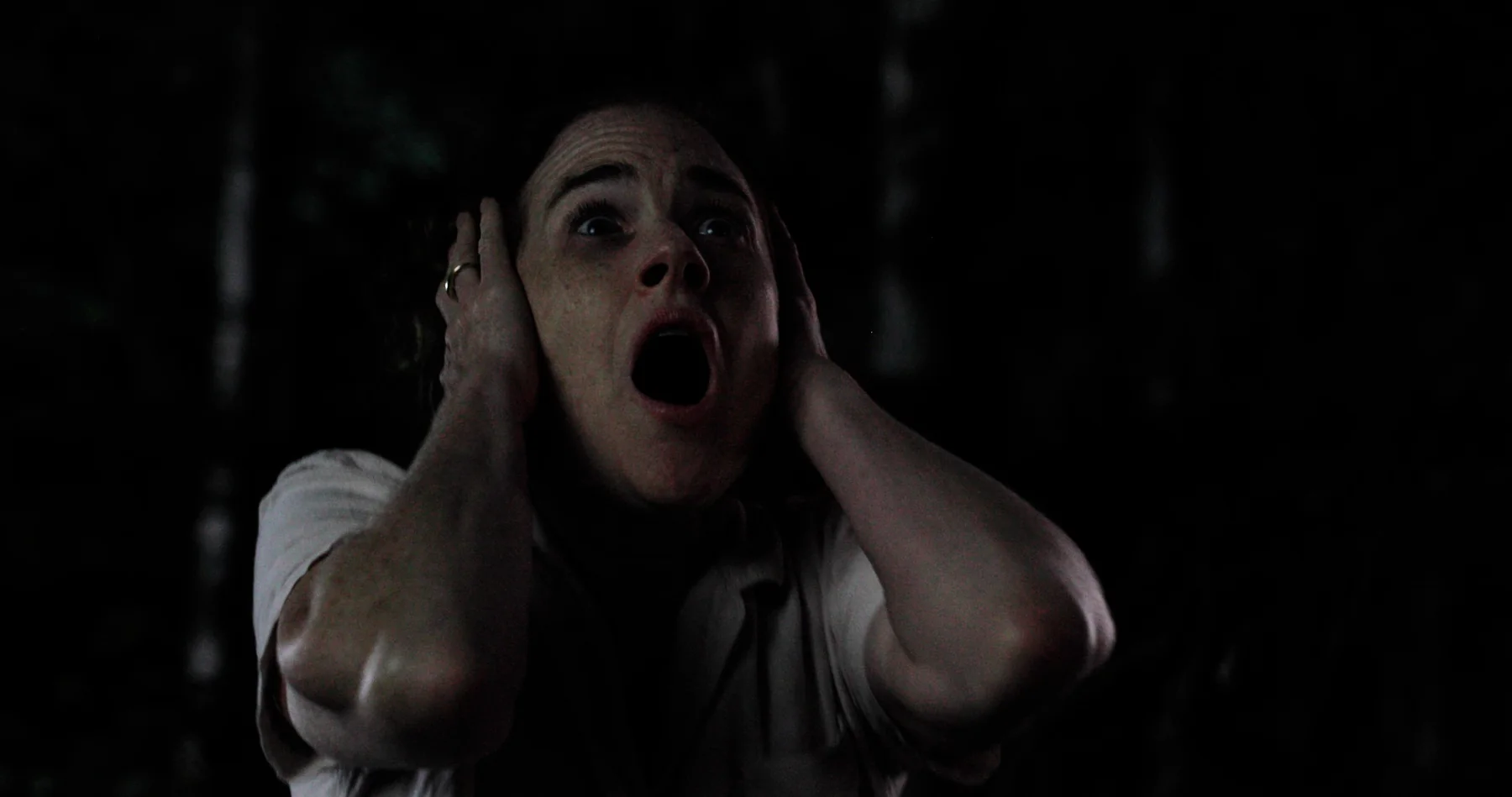 Sonia reacting in darkness