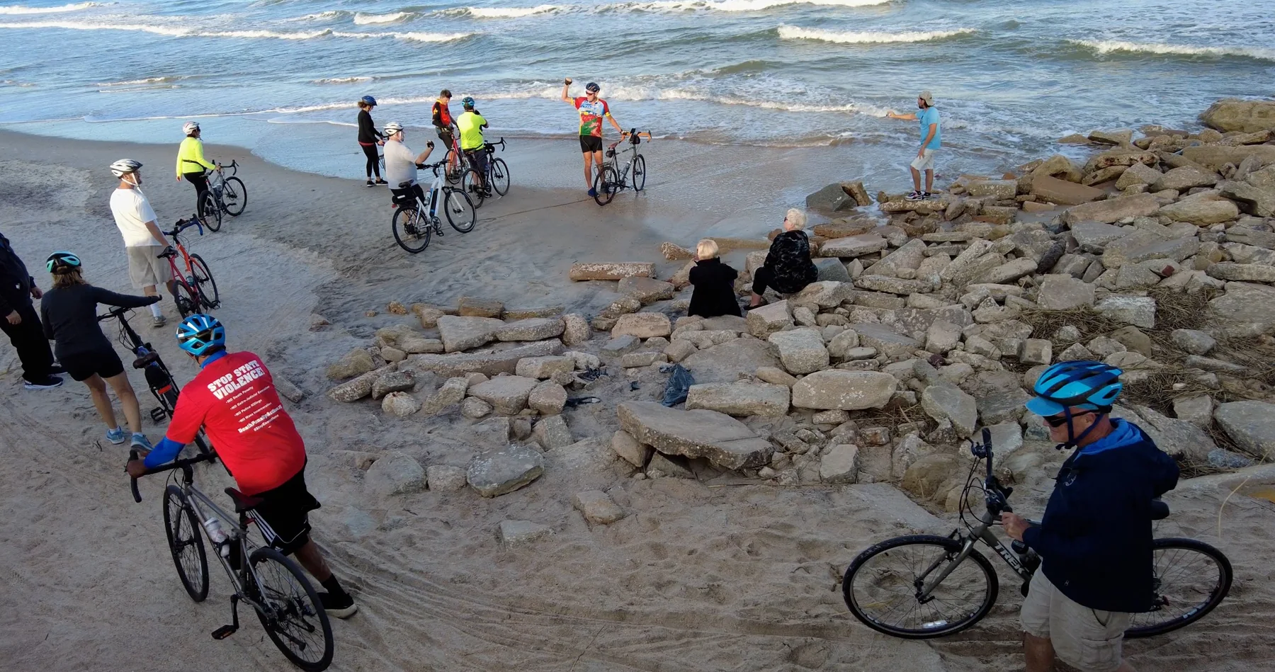 Cyclists gathered at the ocean