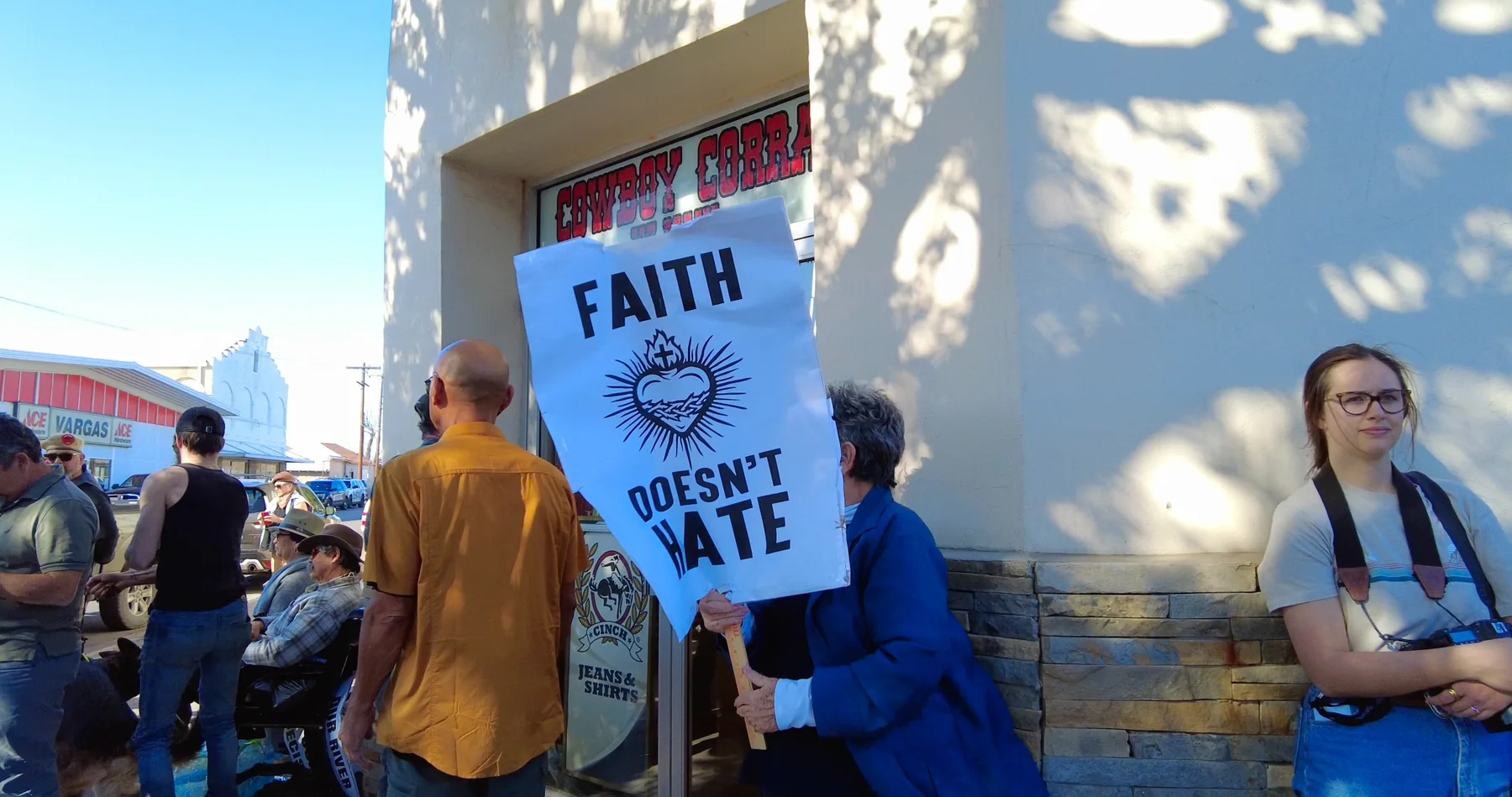 A sign reading Faith Doesn't Hate